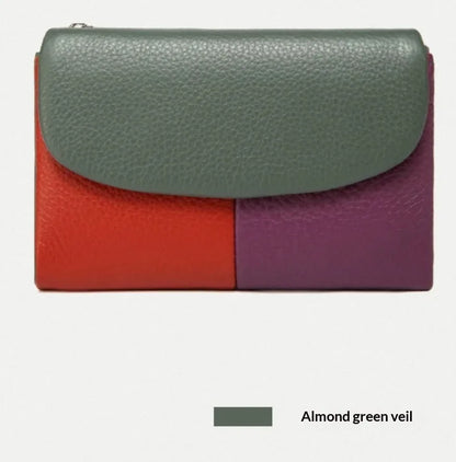 Women's short wallet in soft leather texture with solid colour and stitching detail, urban minimalist style