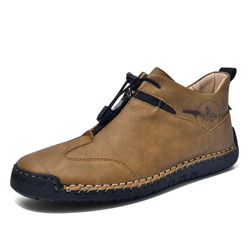 Men's black casual leather shoes with a mid heel, round toe, and visible stitching on a wooden floor.