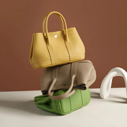 Genuine leather crossbody bag for women in first layer cowhide, horizontal square shape, single shoulder strap, shown in chicken yellow