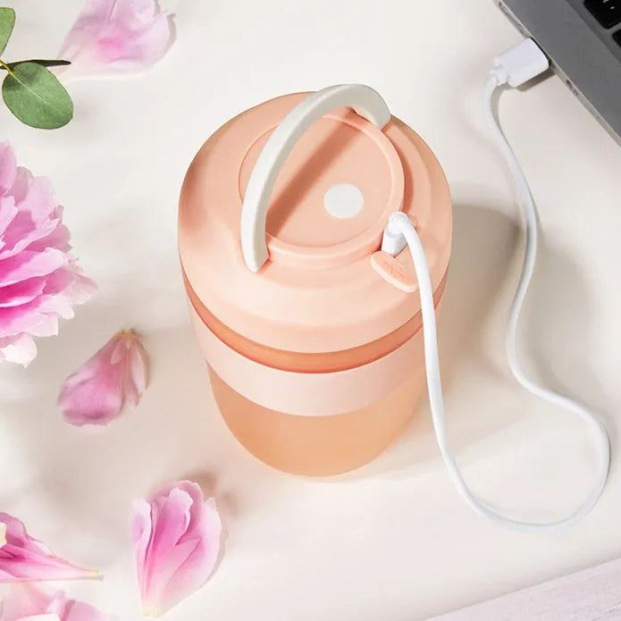 Green portable USB rechargeable blender cup with lid and four stainless steel blades, 400ml capacity.