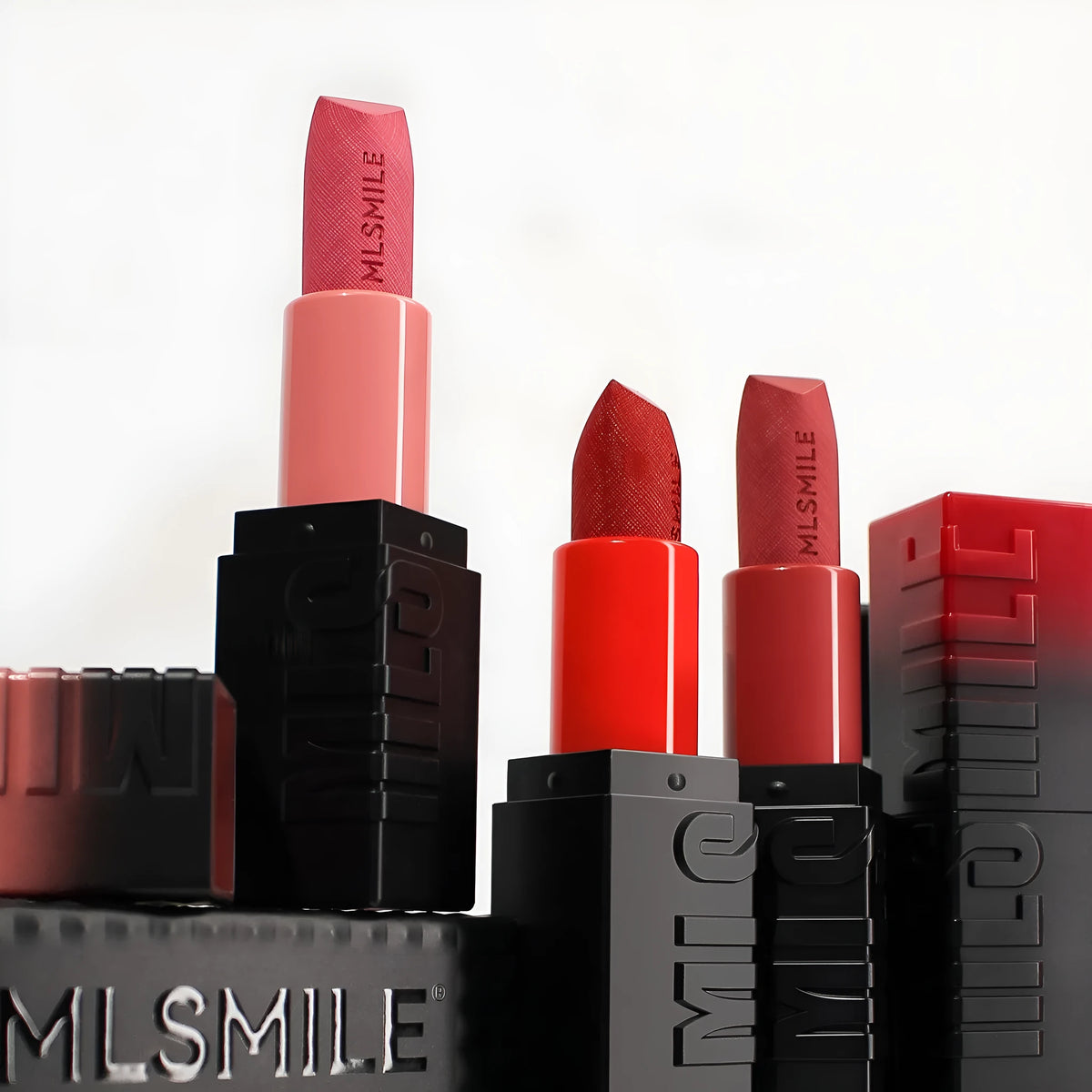 MLSMILE embossed lipstick three-piece set in open box showing three lipsticks.