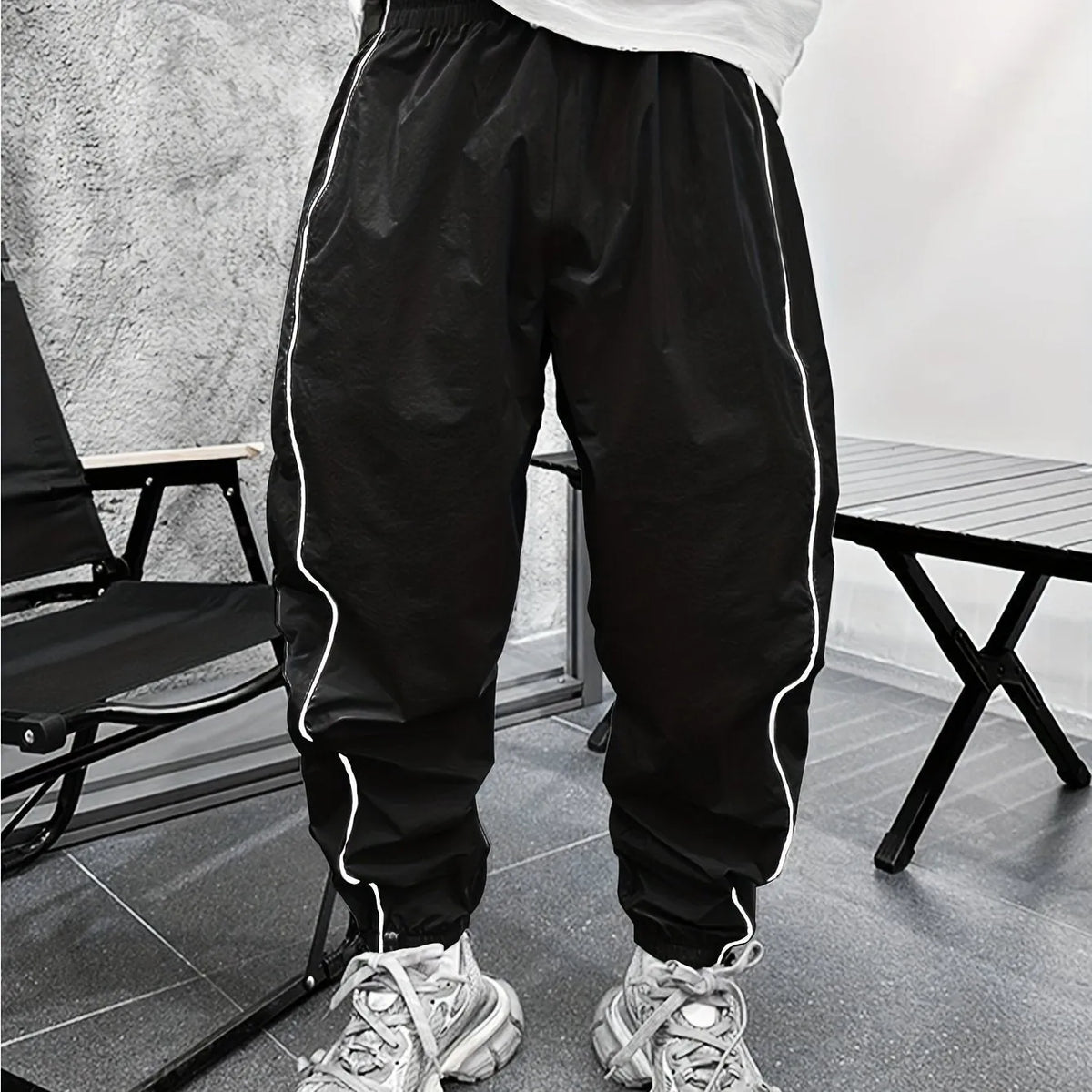 Men's bamboo fibre cropped sports trousers in army green colour showing loose fit and elastic waistband
