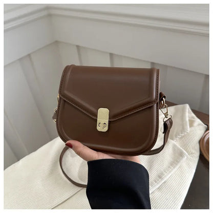 Soft PU leather messenger bag with clamshell opening in black, dark brown, khaki or white.