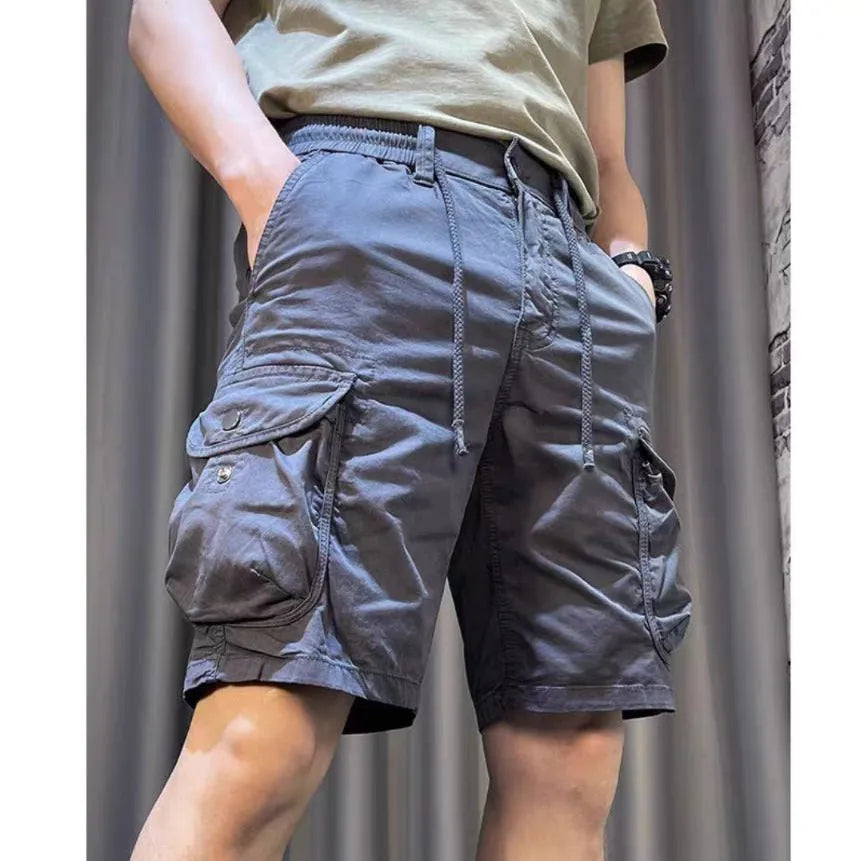 Loose straight multi-pocket casual overalls pants in black, grey, green, or khaki with a relaxed fit and five pockets.