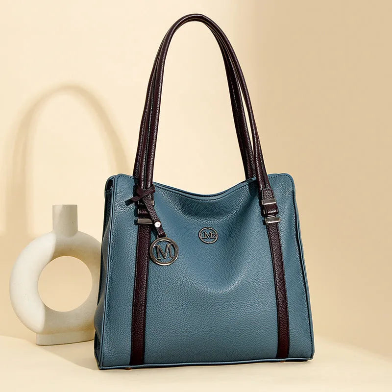 A soft PU leather women's crossbody bag in a retro style with double shoulder straps, shown in a choice of colours.