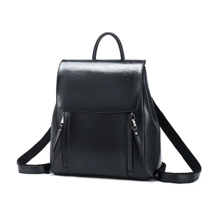 Genuine leather women's backpack with multiple compartments showing stitching details and cover-type opening
