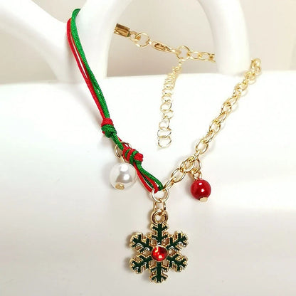 Charming Christmas bracelet with festive charms like Santa, snowmen, and snowflakes
