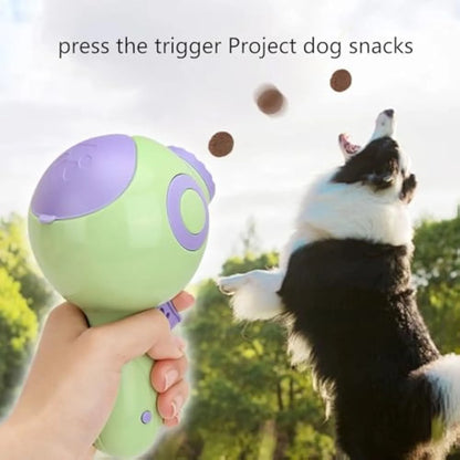 Green interactive dog treat launcher toy with treat dispensing mechanism for training and play