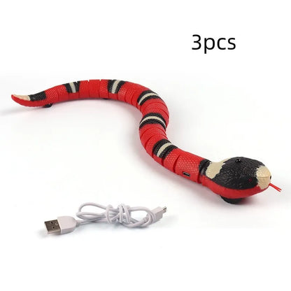 Smart sensing electronic snake cat toy with segmented body for realistic slithering motion on floor.