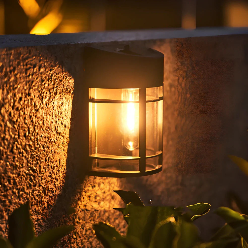 Solar outdoor wall light with warm glow, monocrystalline panel, and IP65 waterproof rating for garden use