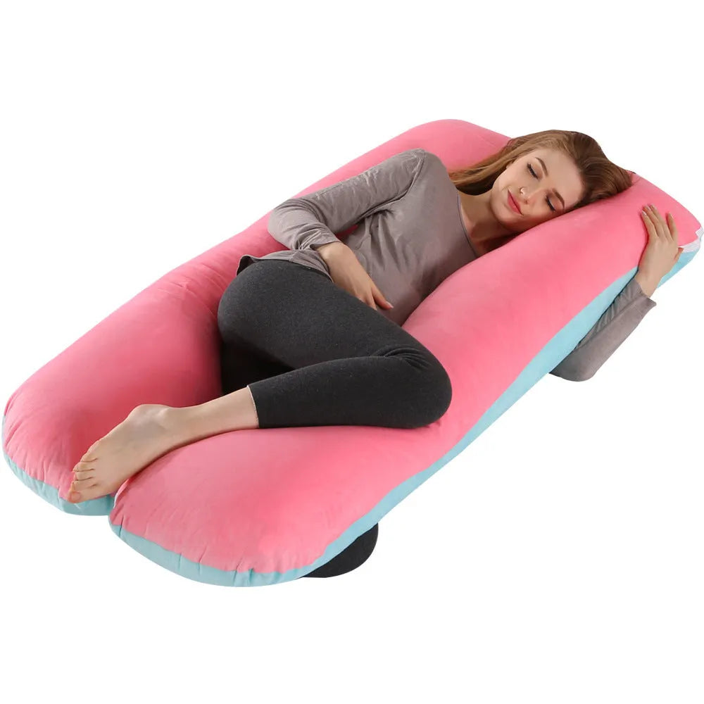 Large U-shaped pregnancy support pillow with removable cover and abdominal support belt.