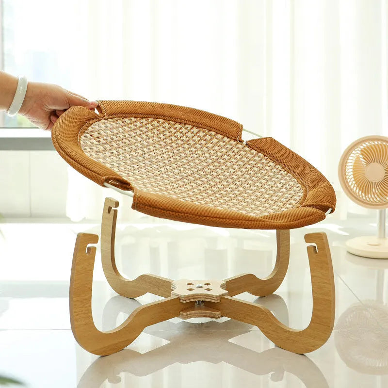 Brown square woven rattan pet hammock bed for cats and small dogs, shown off the ground.
