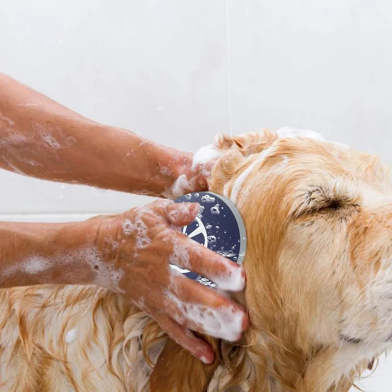 Blue, grey, and yellow 3-in-1 dog shampoo brush with massage points on a white background.