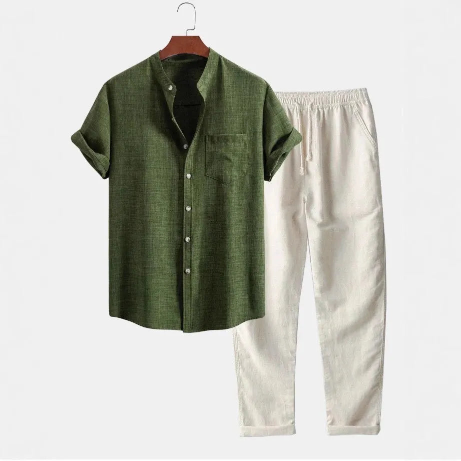 Men's blue slim-fit short-sleeved shirt with stand collar, part of a casual set with pants and shoes.