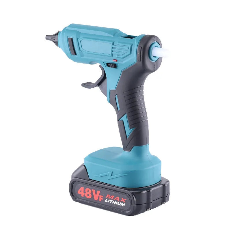Cordless hot melt glue gun with bare metal body, two lithium batteries, charger, and pack of 11mm glue sticks.