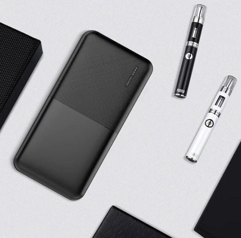 Black and white 20000 mAh power bank with heating function showing multi-USB ports