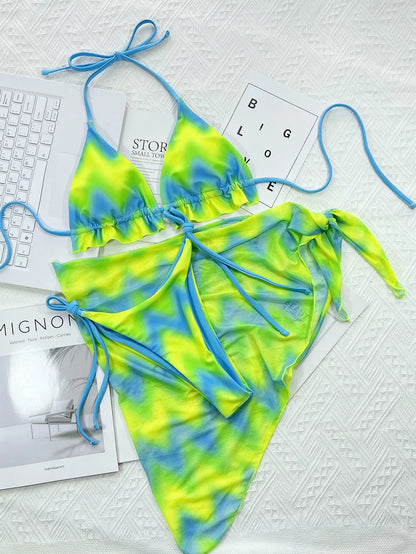 Tie-dye green nylon bikini set with bra, pants, and skirt for swimming