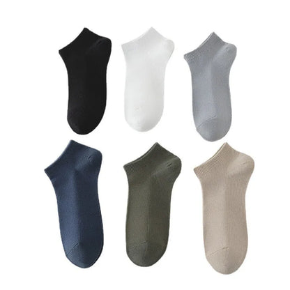 Pair of solid colour low-cut polyester boat socks for men, shown in one of six available colour options.