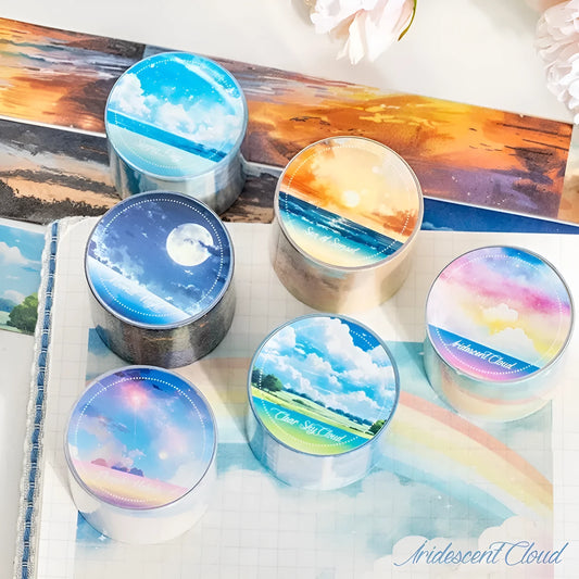 Roll of Japanese paper sky theme washi tape showing colourful clouds design, 30mm width