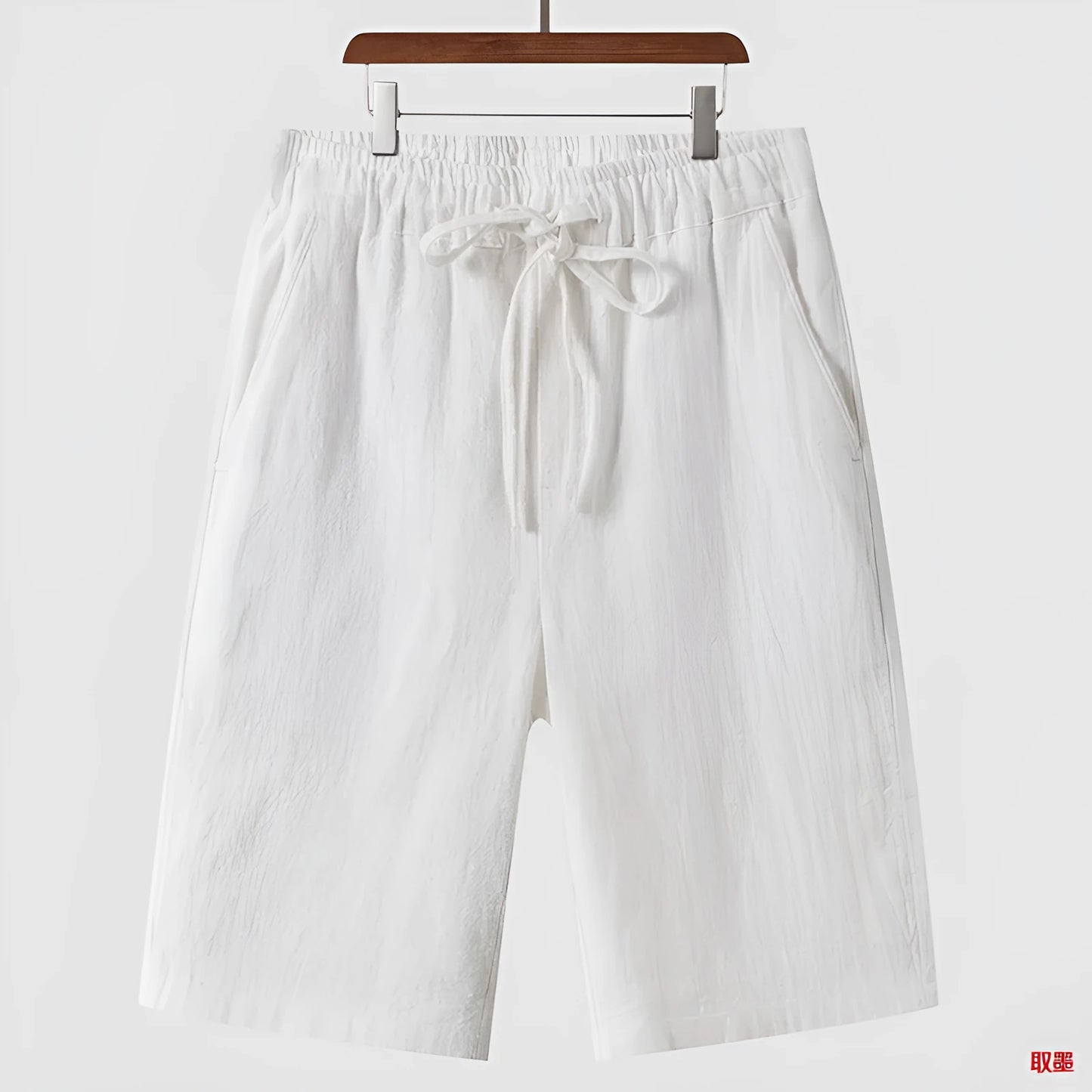 Men's linen casual shorts with elastic waistband in loose cropped design showing beige colour option
