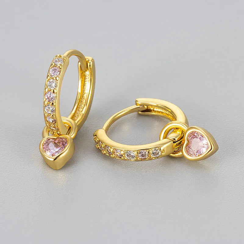 Fashion zircon earrings with 10mm heart-shaped drops in gold and white gold settings, showing diamond-treated stones