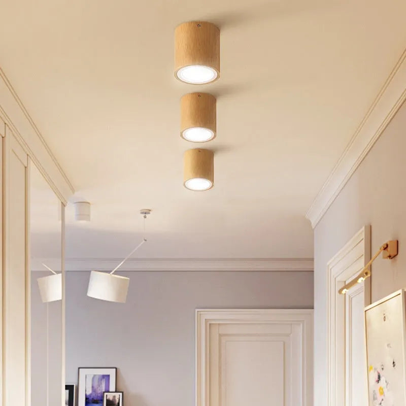 Solid wood surface mounted downlight in wood colour with round or square design options for corridor lighting