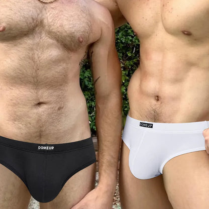Men's solid colour seamless briefs in low waist style shown in black, white, and pink.