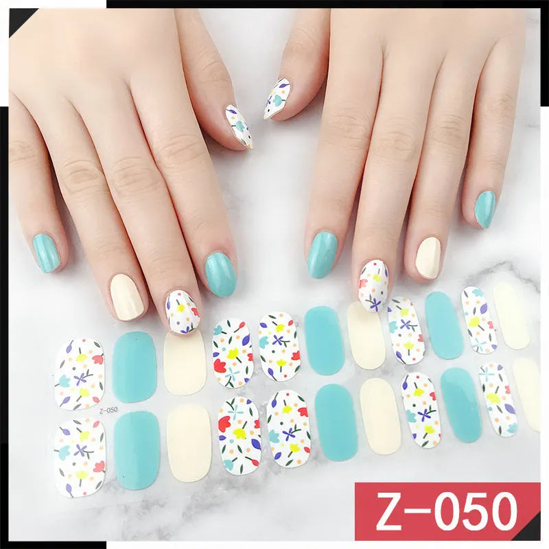Korean nail stickers sheet showing cartoon, flower, and strawberry patterns with a nail file.