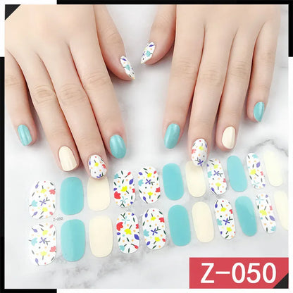Korean nail stickers sheet showing cartoon, flower, and strawberry patterns with a nail file.