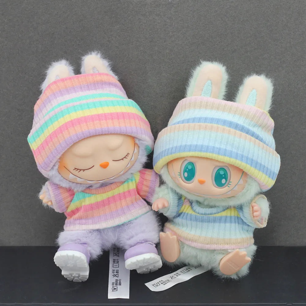 Doll clothes set with knitted flanging hat and T-shirt in multiple colours including pink, white, and stripes.