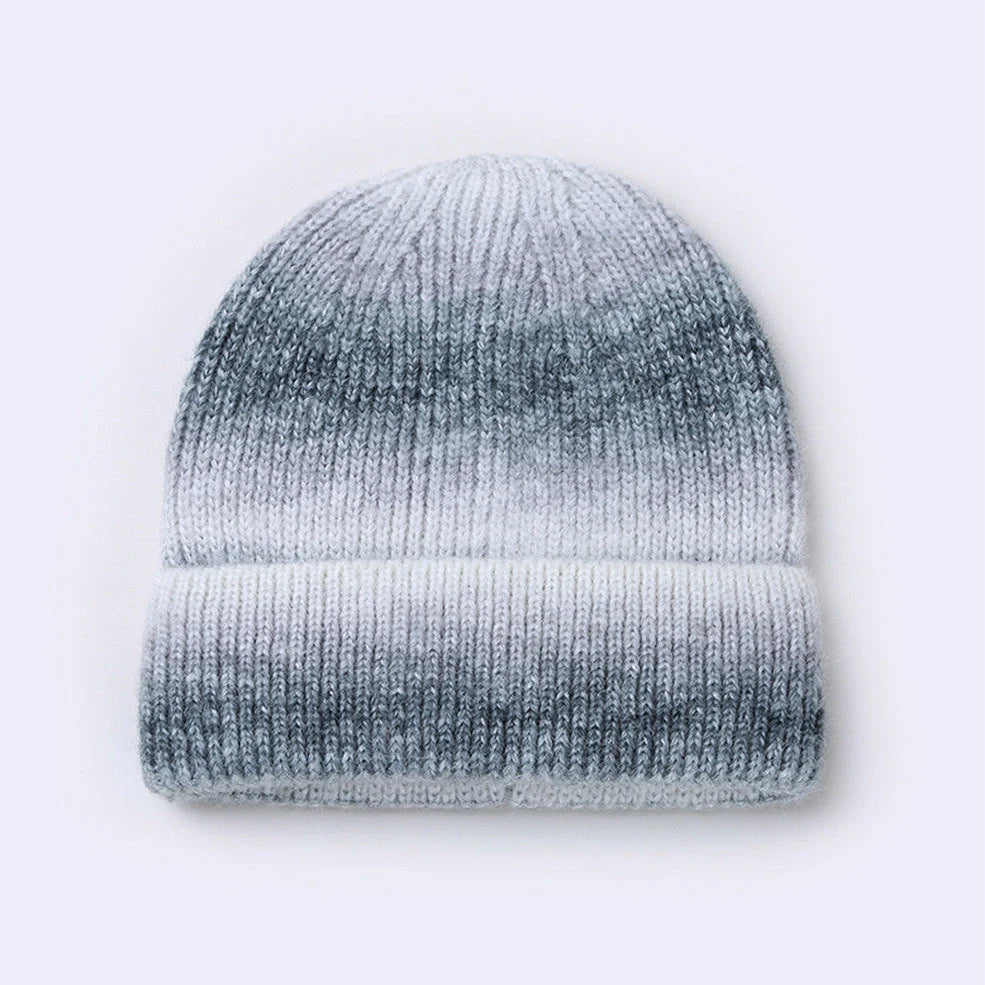 Gradient yarn knitted hat with tapered top in light blue colour showing knitted texture