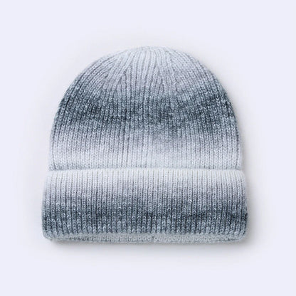 Gradient yarn knitted hat with tapered top in light blue colour showing knitted texture