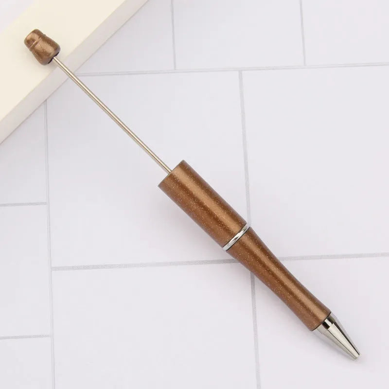Rotating bead ballpoint pen in gradient colour with ABS plastic and steel wire construction