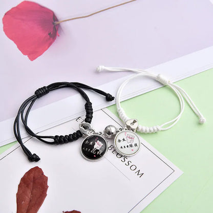 Magnetic suction couple bracelet pair in alloy with an electroplated finish, showing example designs like a crown and love lock.