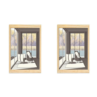 LED illuminated decorative picture light on a table showing a scenic landscape image glowing from within.