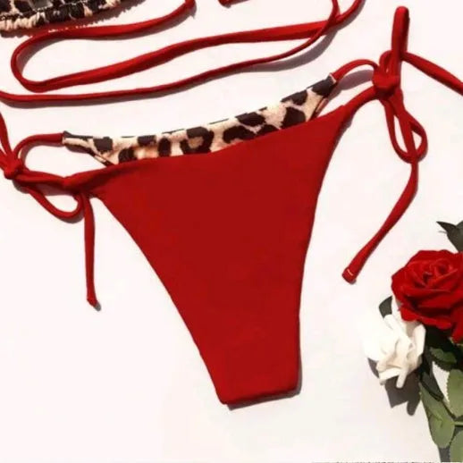 Women's leopard print halter bikini with lace-up ties and split leg swim bottoms