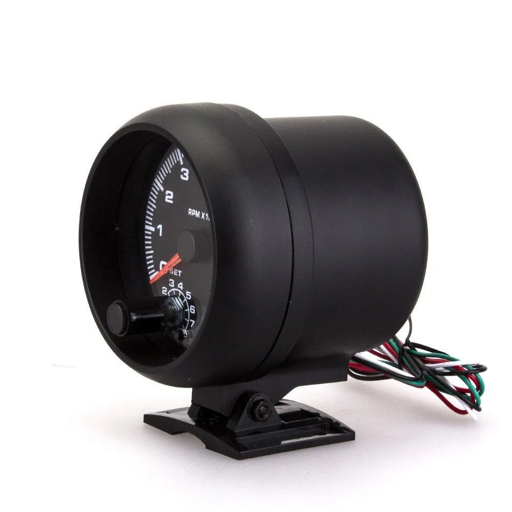Black automotive tachometer with blue light pointer showing 0-8000 RPM scale.