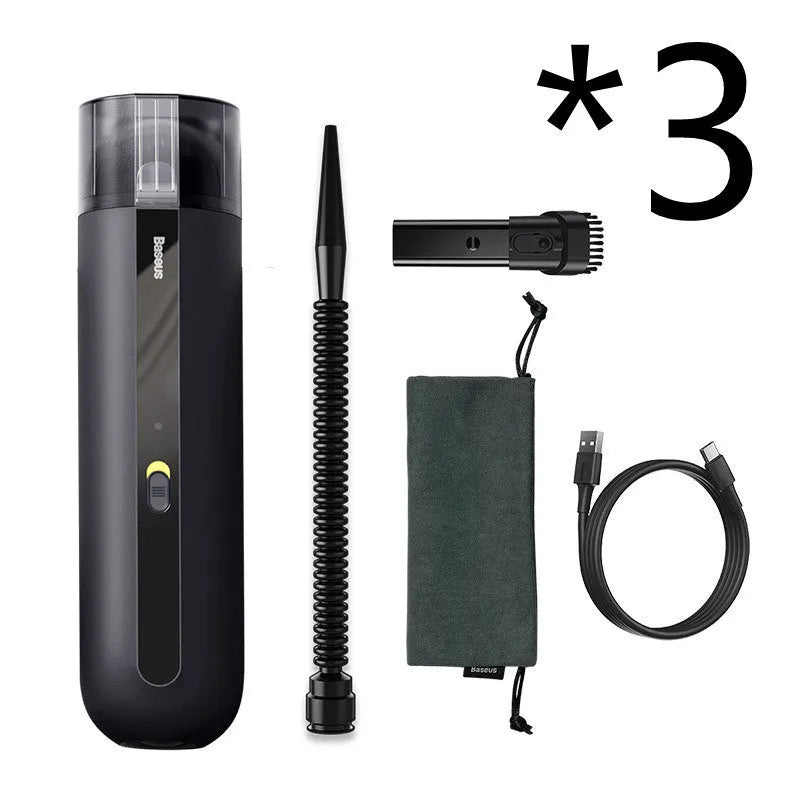 BASEUS handheld car vacuum cleaner in black with blowing hose attachment, showing compact size and dust bin