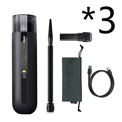 BASEUS handheld car vacuum cleaner in black with blowing hose attachment, showing compact size and dust bin