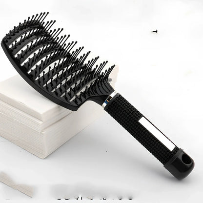 Large curved hairbrush with boar bristles showing 15cm width and natural bristle distribution