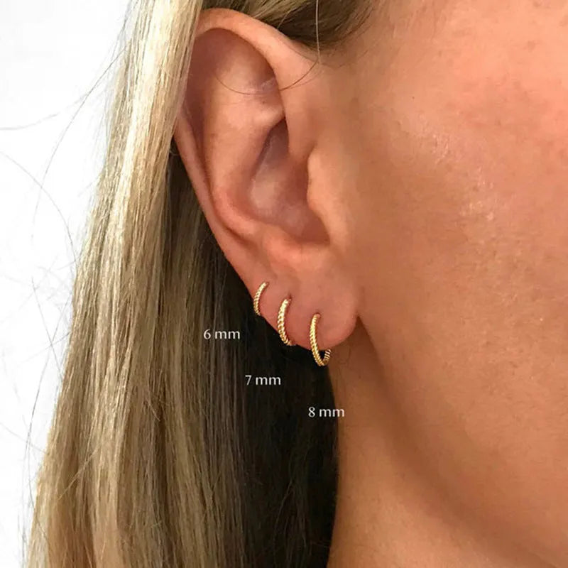 Sterling silver twisted string round ring earrings in gold or platinum colour.