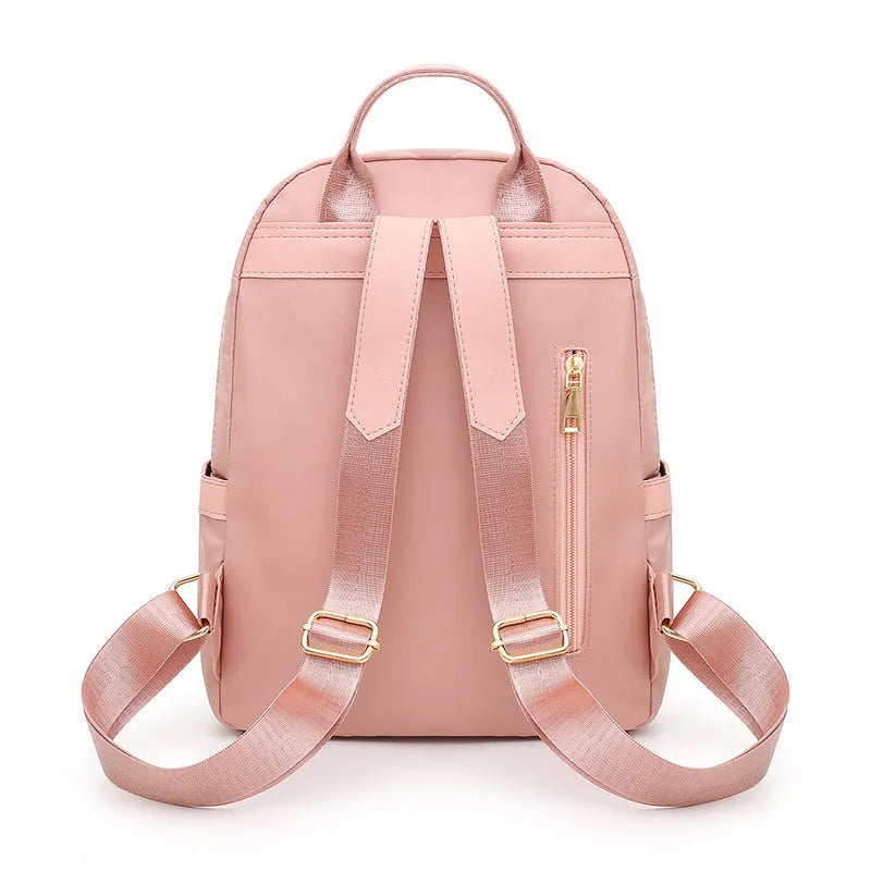 Black square vertical nylon backpack with double shoulder straps showing multiple compartments and anti-theft features