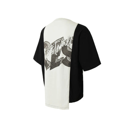 Black and white broken collage print on a loose short sleeve cotton blend T-shirt.