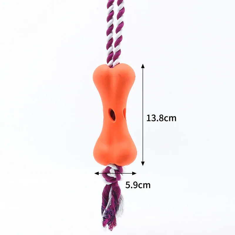 Green porous bone dog chew toy with rope knot texture for treat insertion and dental stimulation