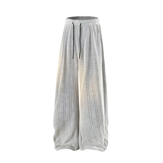 Straight-leg fleece-lined casual trousers in black on a hanger, showing elastic waistband.