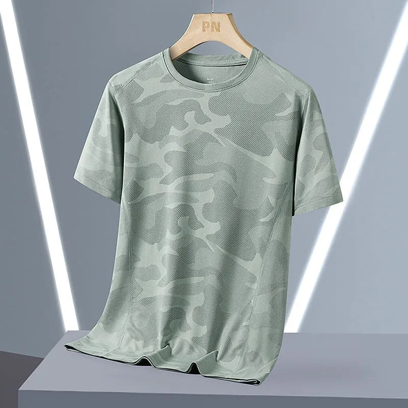 Men's loose fit camouflage nylon short sleeve summer top on a hanger