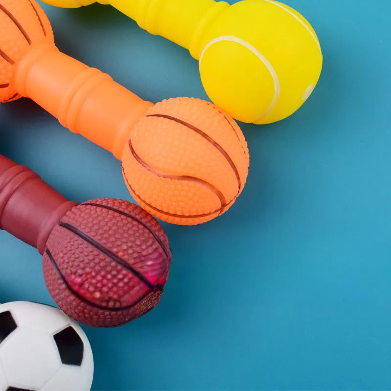 Brown, orange, white, and yellow PVC football dumbbell squeaky dog chew toy.