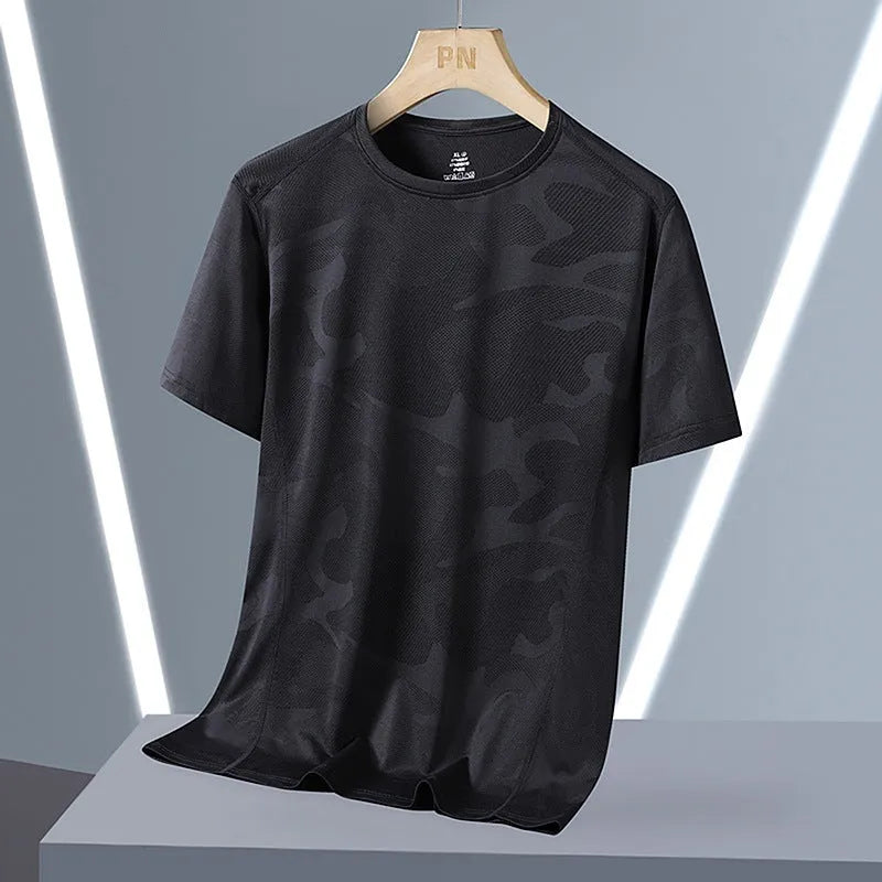 Men's loose fit camouflage nylon short sleeve summer top on a hanger