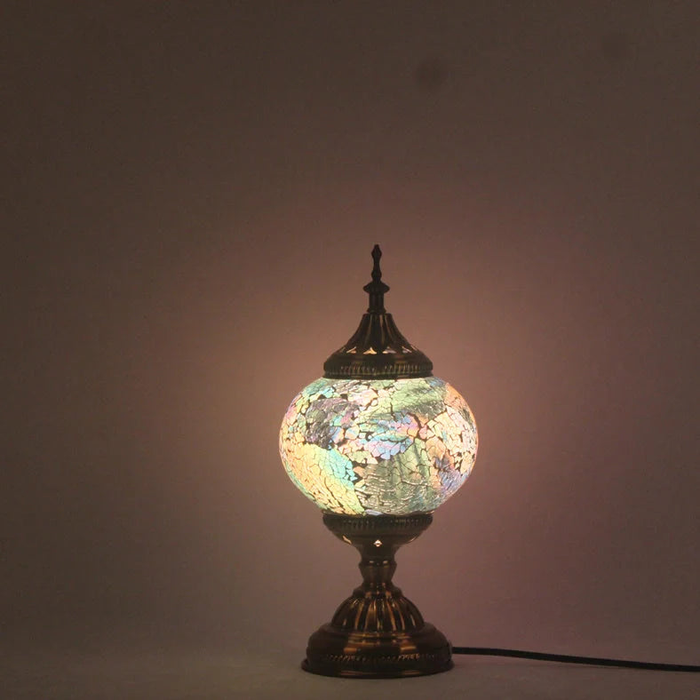 Glass table lamp with 150mm diameter shade and 330cm cord on wooden surface