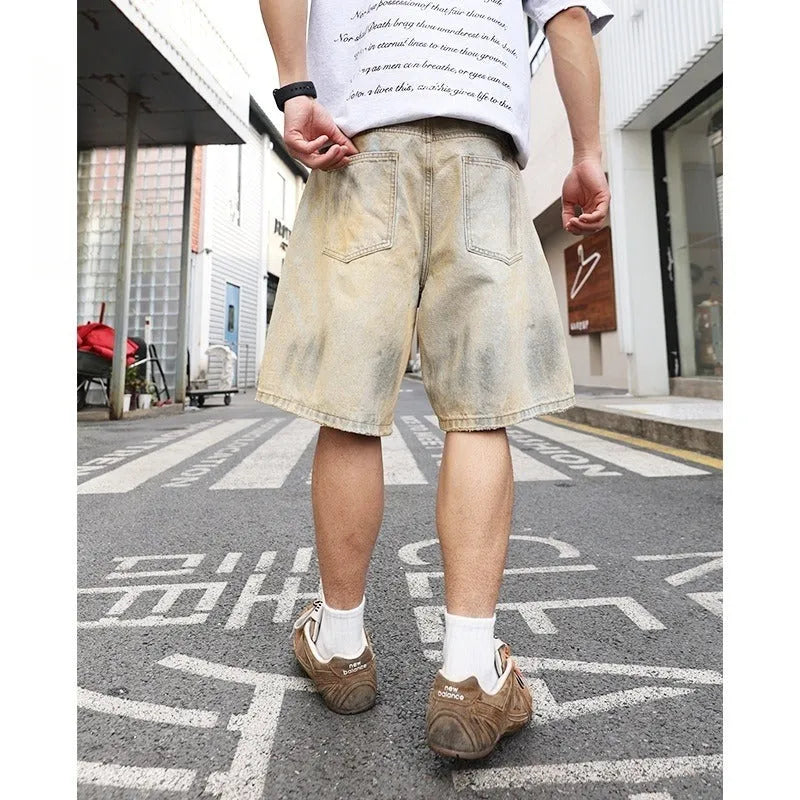 Men's light blue ripped denim shorts with straight-leg style and mid-waist design